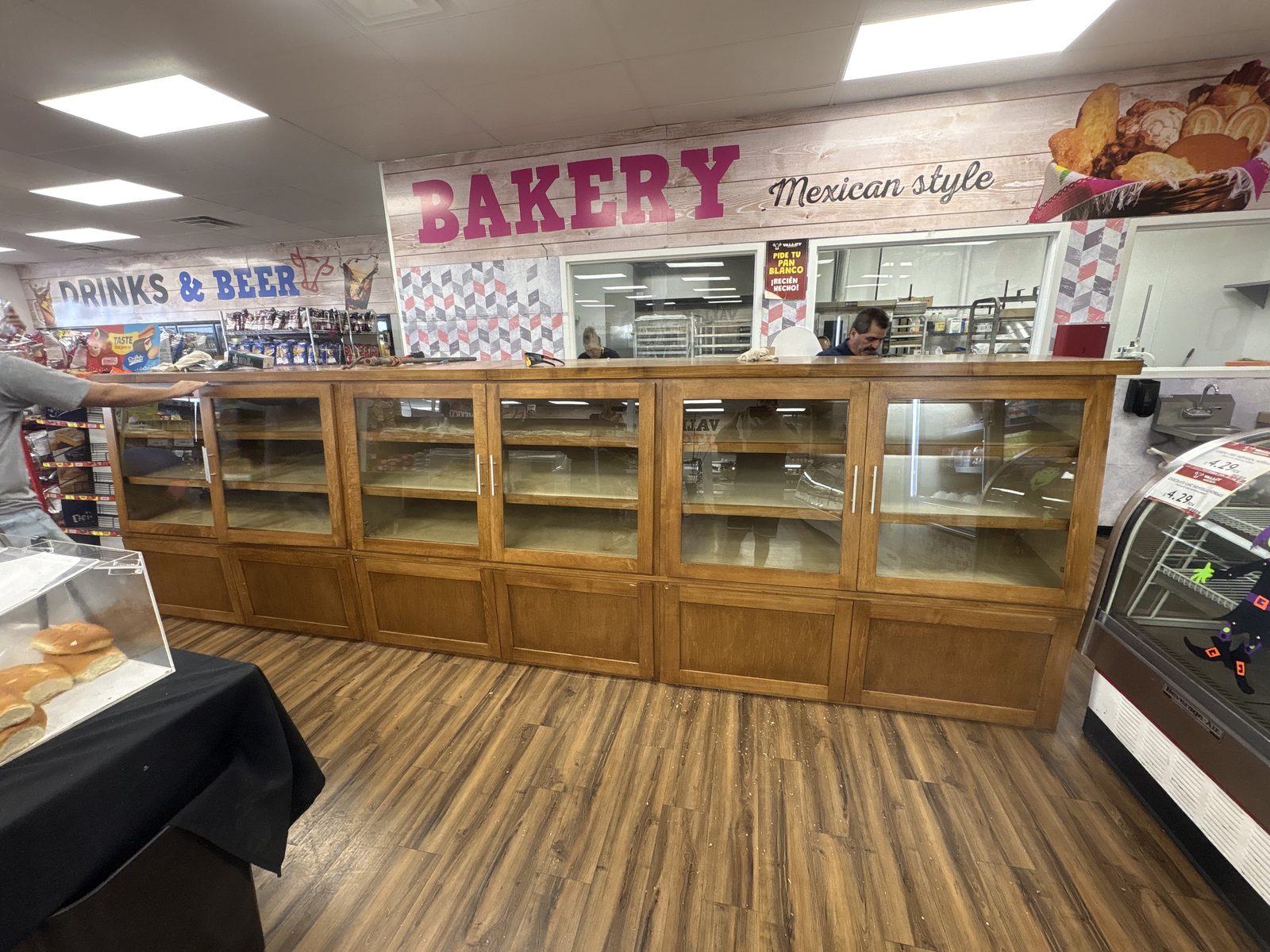Bakery display cases with glass doors along the bakery counter